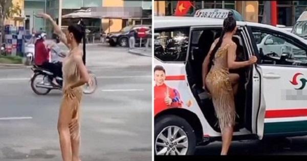 H'Hen Niê mặc Nguyên đầm dạ hội đứng vẫy taxi ngoài đường