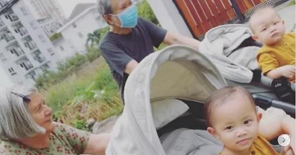 Mẹ chồng người Thụy Điển của Hồ Ngọc Hà mặc đồ ngủ Việt Nam đẩy xe cho cháu đi dạo ngoài đường